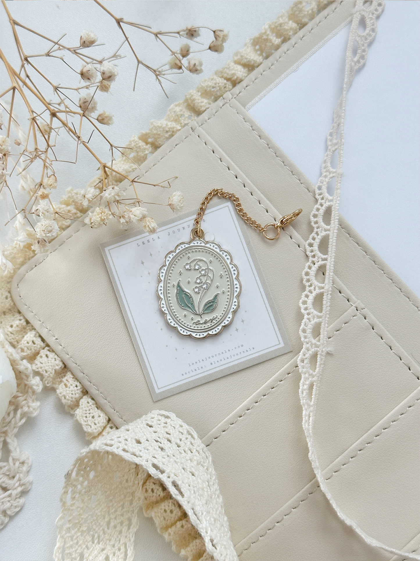 framed lily of the valley enamel keychain